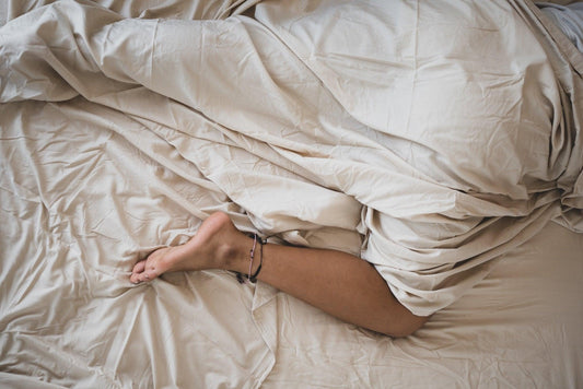 Hot sleeper with leg out of covers