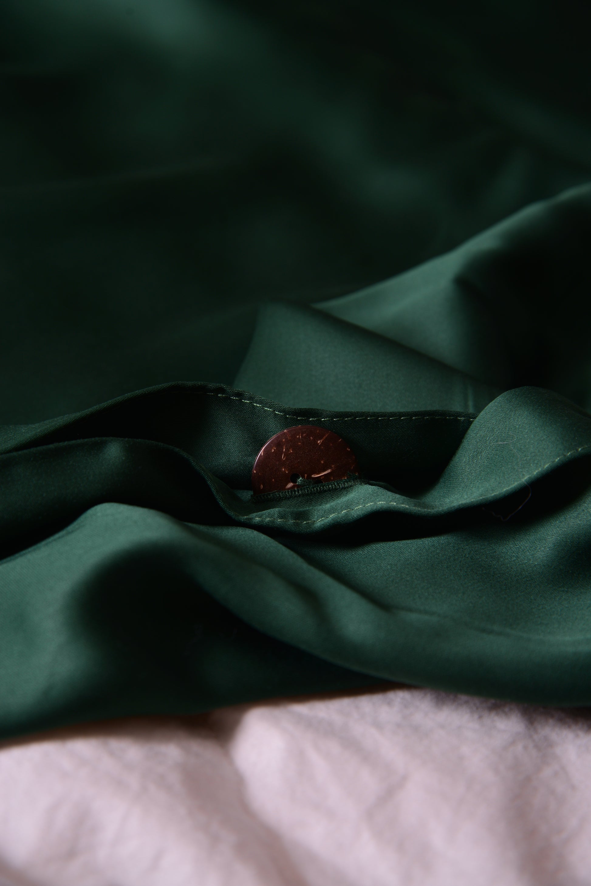 Forest green duvet cover with coconut button and hidden seams