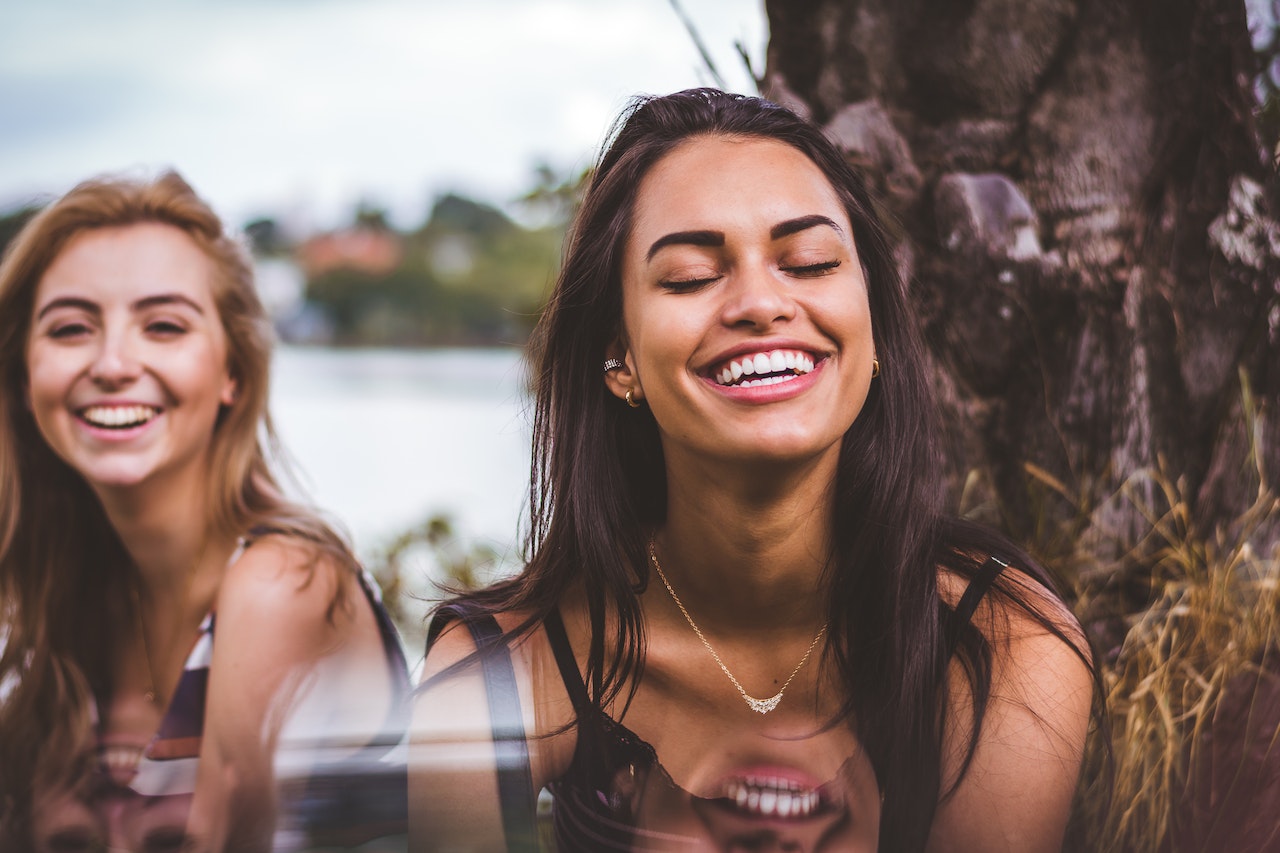 girl smiling and showing her white and beautiful teeth