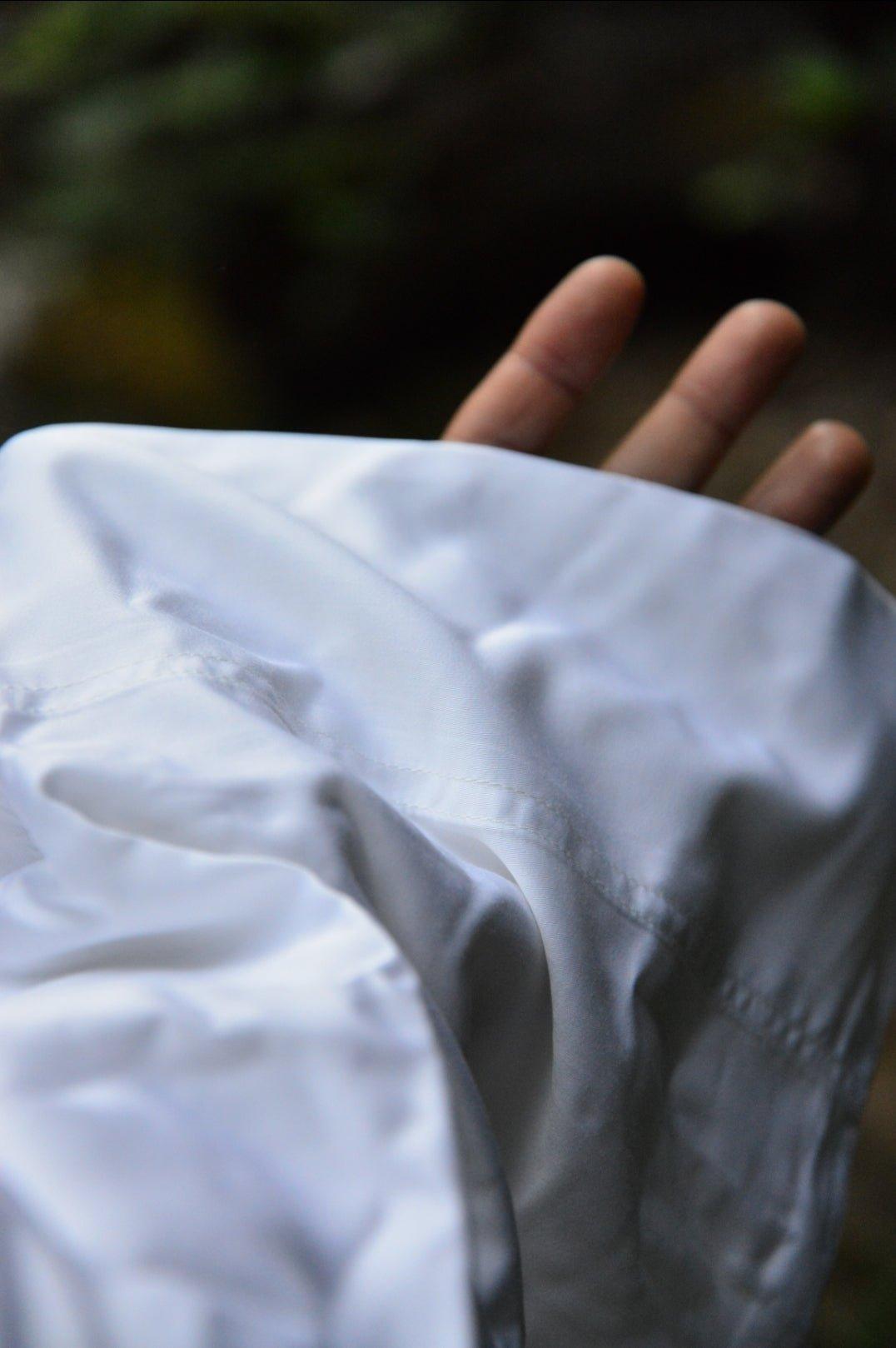 Close up of silky bamboo fabric draped over hand