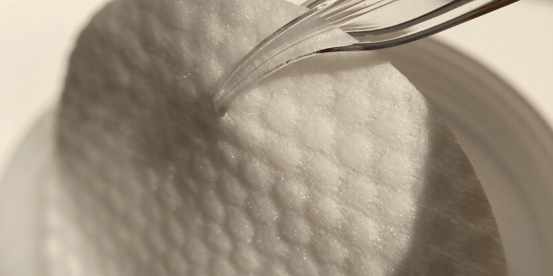 A close up of a standard cotton face round and it looks very rough in texture