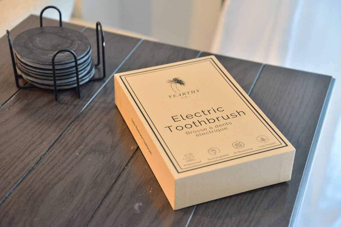 Vearthy bamboo sonic electric toothbrush sits on a brown table 