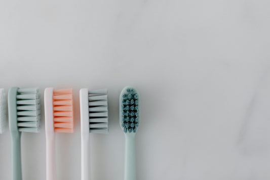 Various toothbrush heads are lined up against a white background - almost like theyre getting a mug shot Vearthy.com