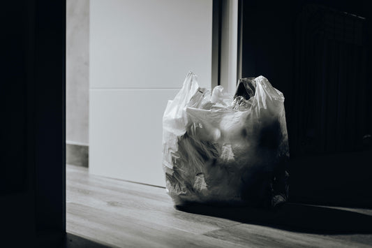 consumer waste sits in a bag on the floor