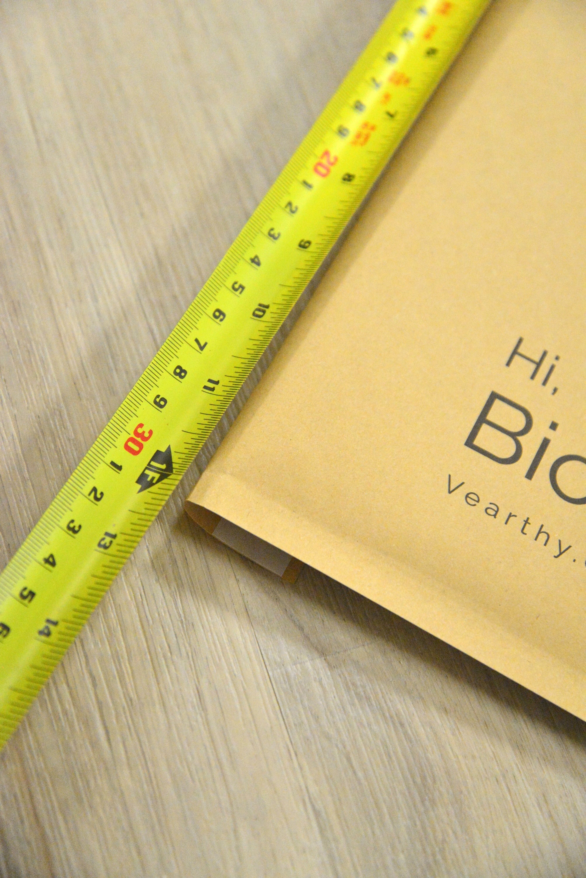 measuring tape showing Vearthy Compostable Mailer is 12"