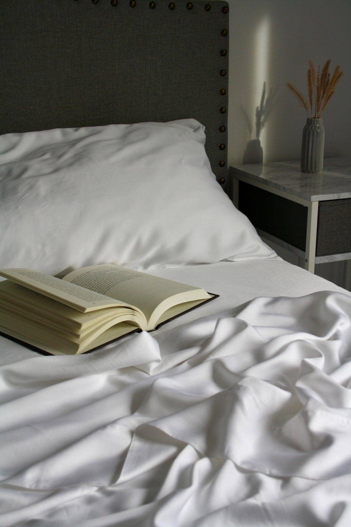 book on a new with white vearthy sheets